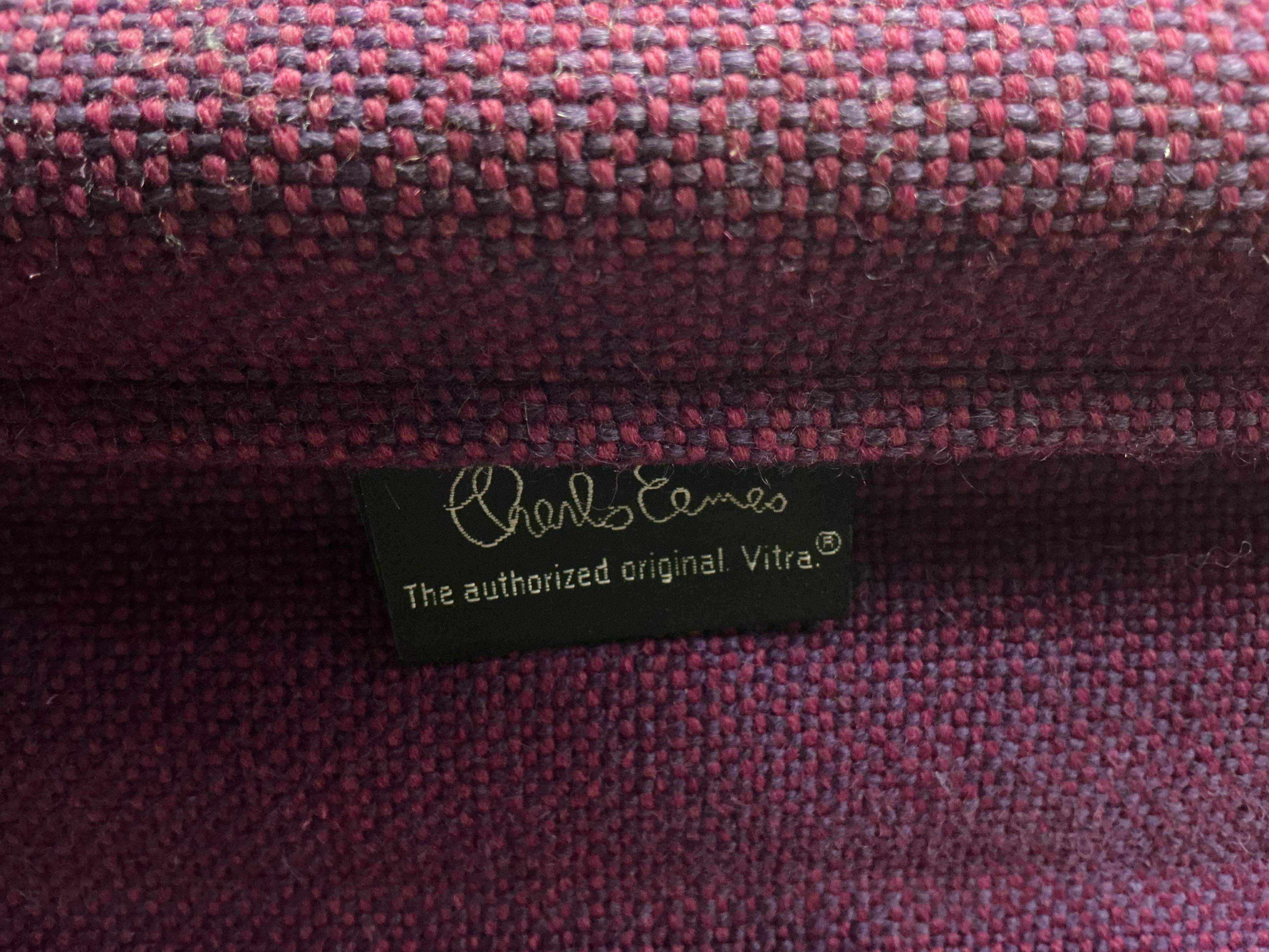 Charles Eames for Vitra, a pair of chrome swivel desk chairs on four prong bases, width 57cm, depth 50cm, height 82cm